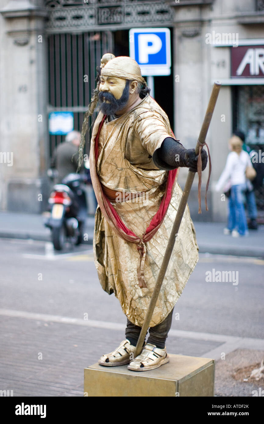 Pantomime in golden garb in Barcelona Stock Photo