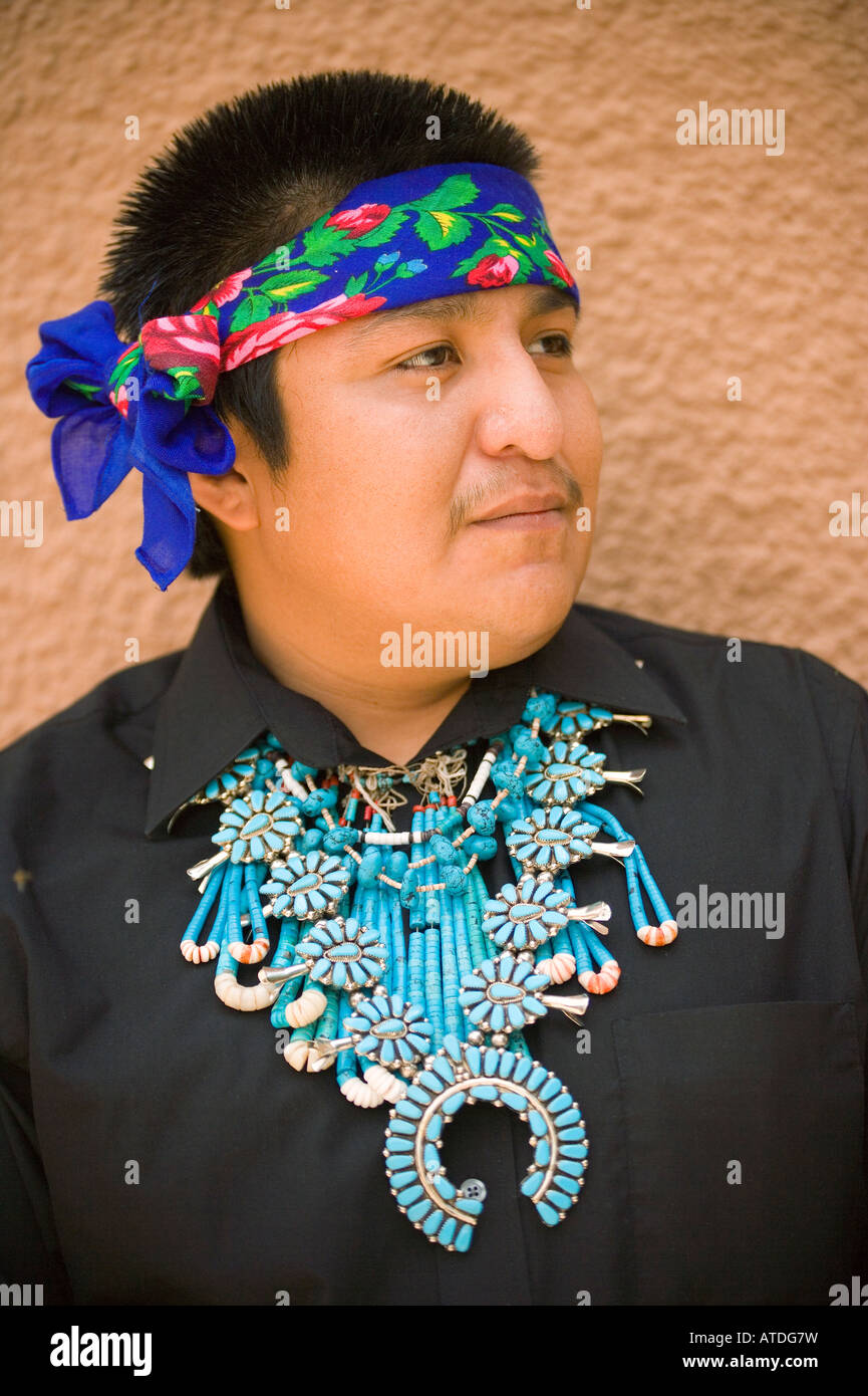 Zuni Pueblo Indian wearing silver and turquoise squash blossom necklace ...