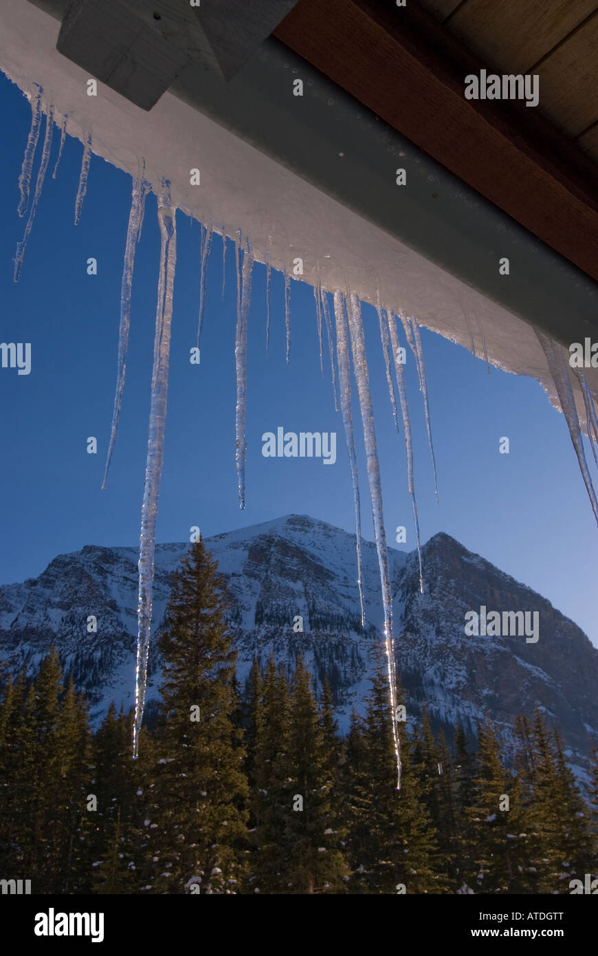 winter icicles frozen ice spikes hang from roof bright sparkling sparkle, glitter glisten, flash