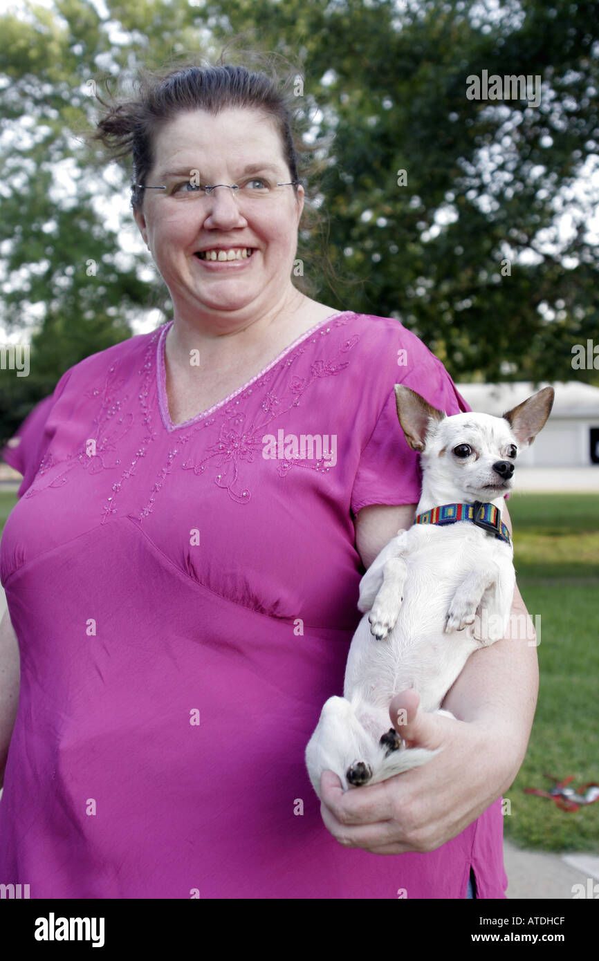 large woman holding a chihuahua Stock Photo