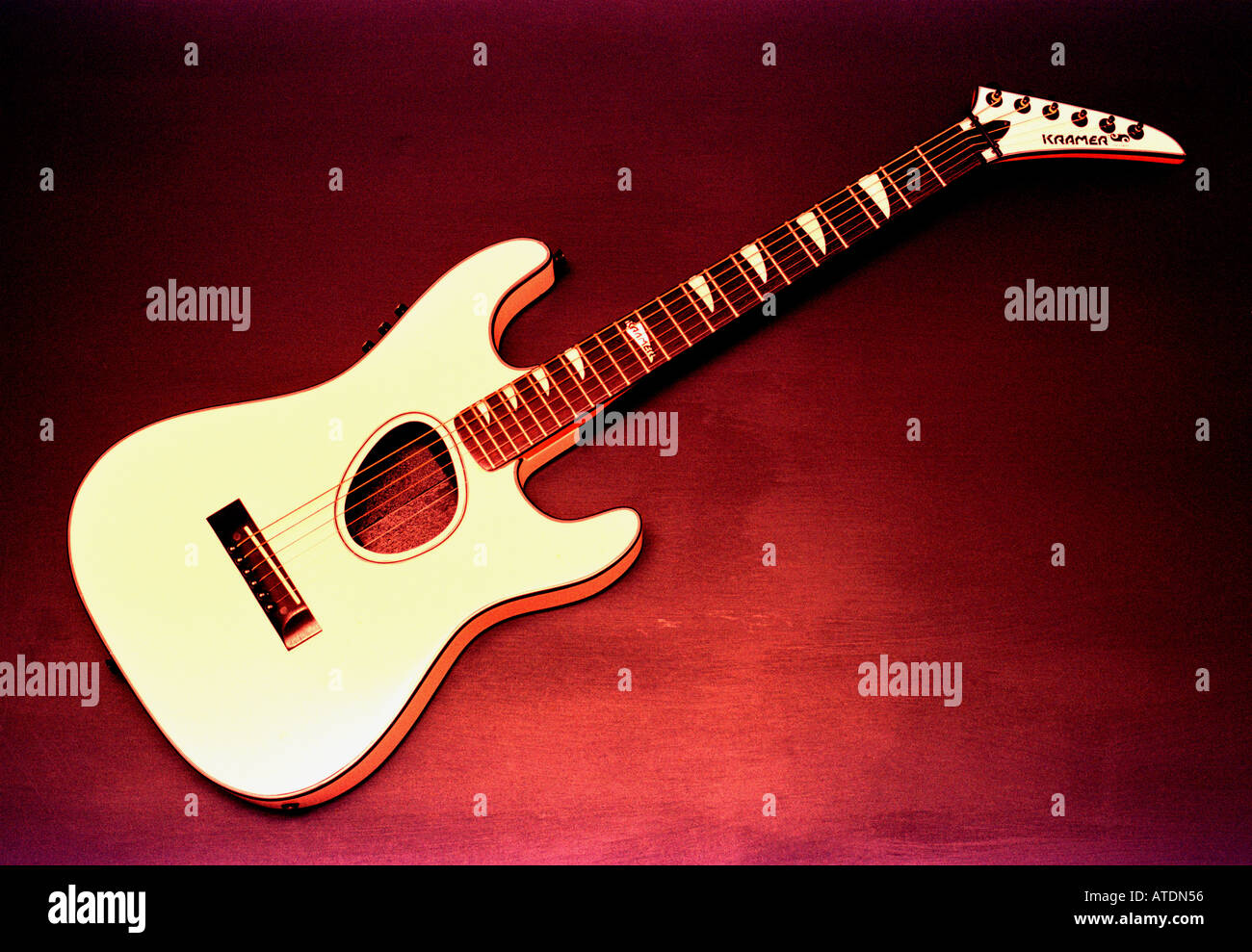 WHITE GUITAR RED BACKGROUND Stock Photo - Alamy