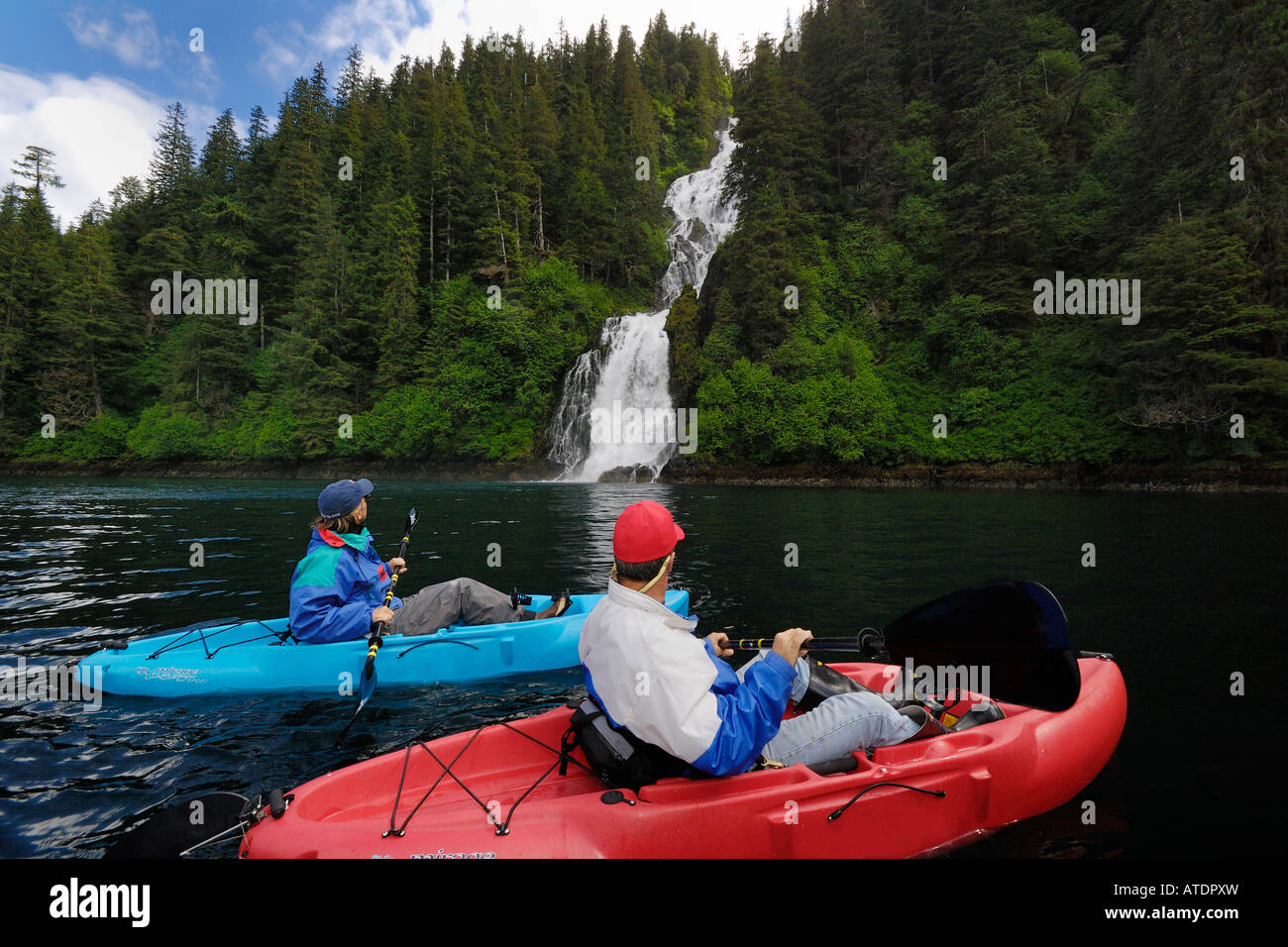Sea Kayaking Near Waterfall In Red Bluff Bay Baranof Island Alaska Sea Kayaking Near Waterfall In Red Bluff Bay Baranof Island Alaska