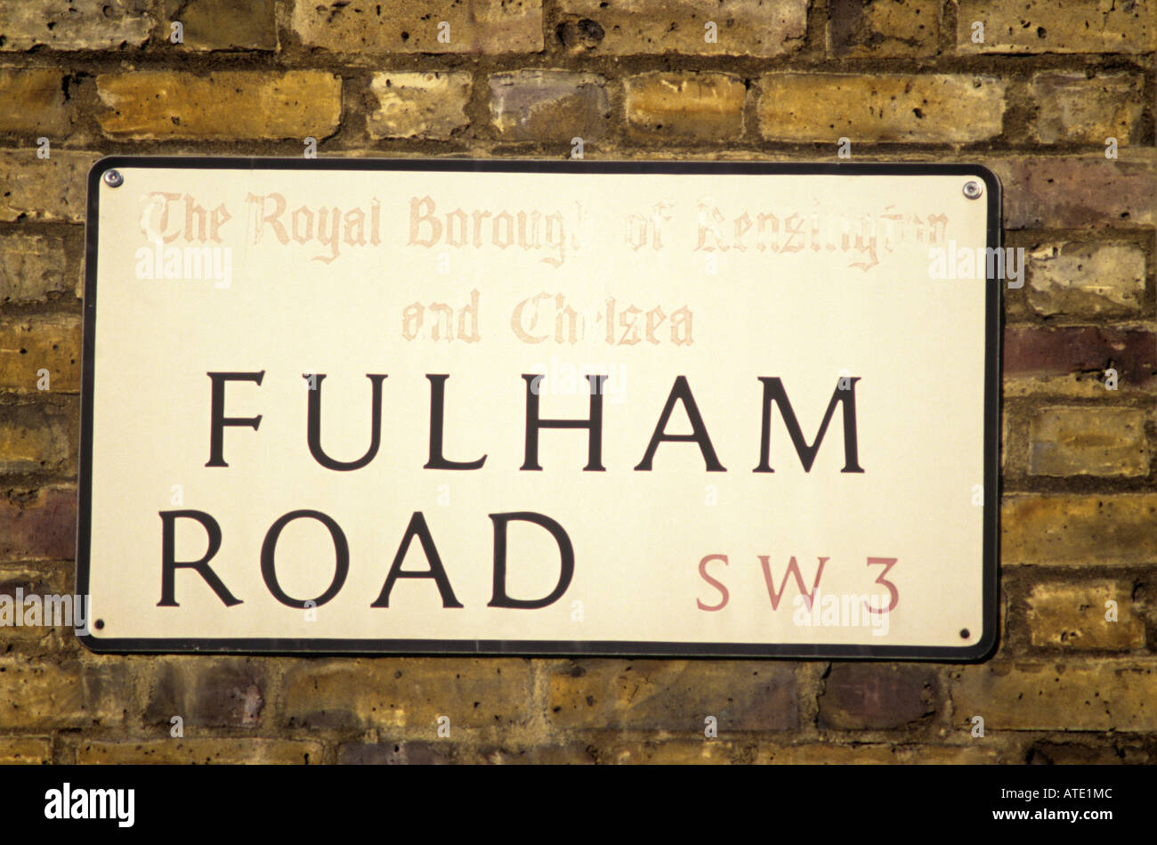 STREET SIGN OF FULHAM ROAD ON YELLOW BRICK WALL LONDON ENGLAND Stock ...