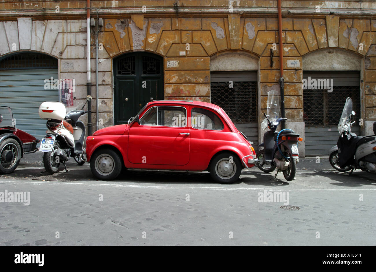 Red Fiat 500 parked in a street in Rome Italy Stock Photo - Alamy