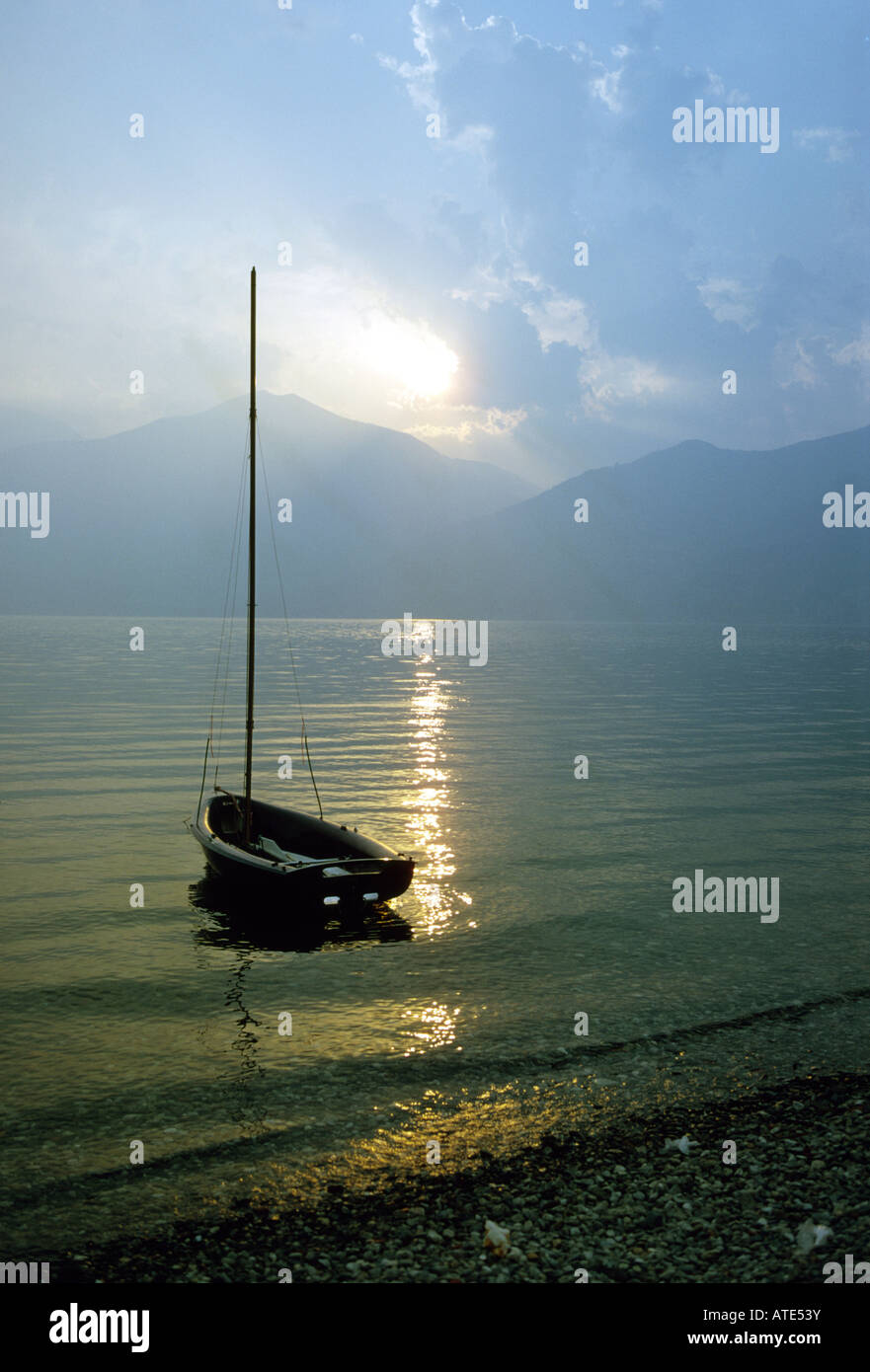 Sunset over mountain lake Stock Photo - Alamy