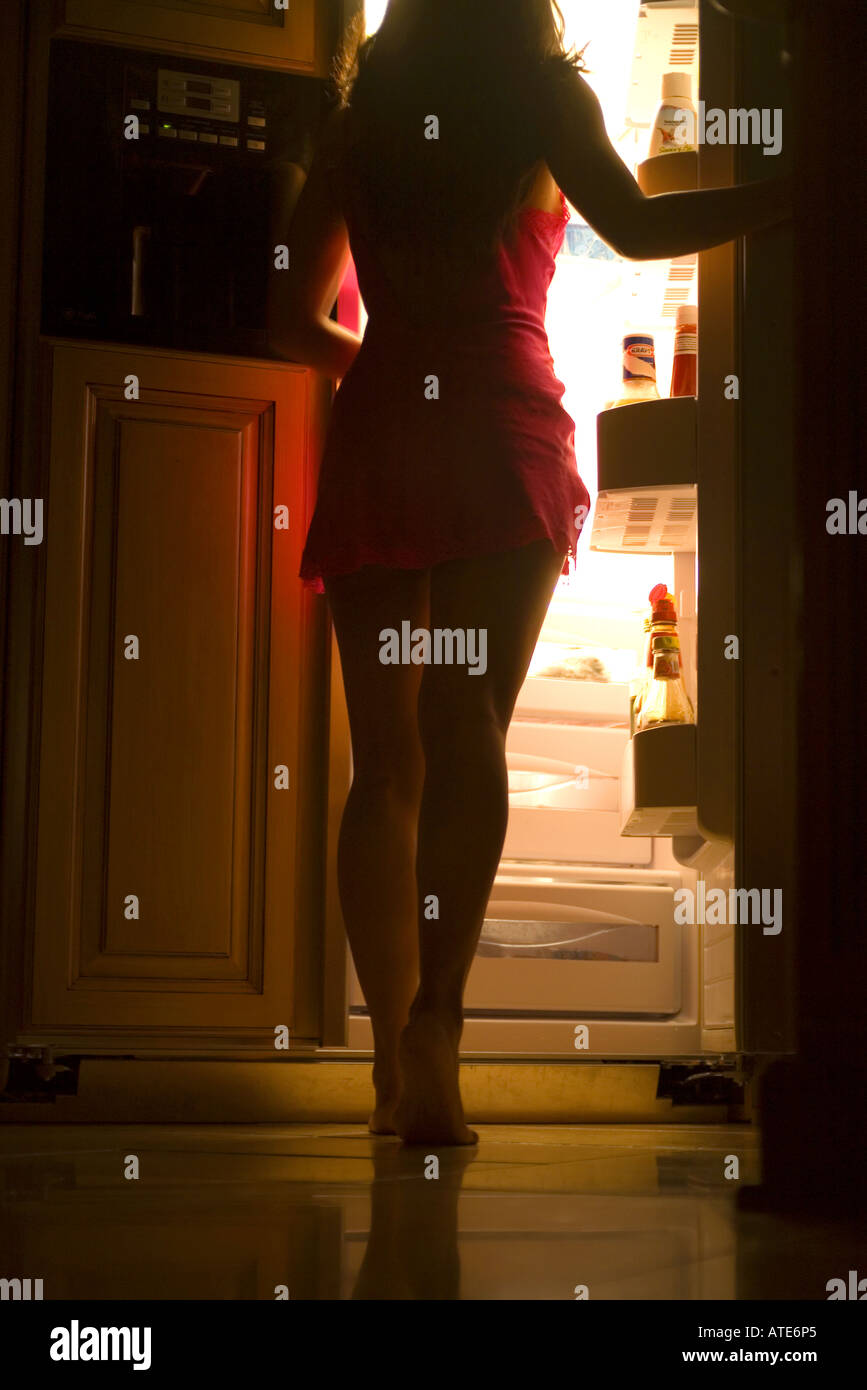 A women getting a midnight snack Stock Photo