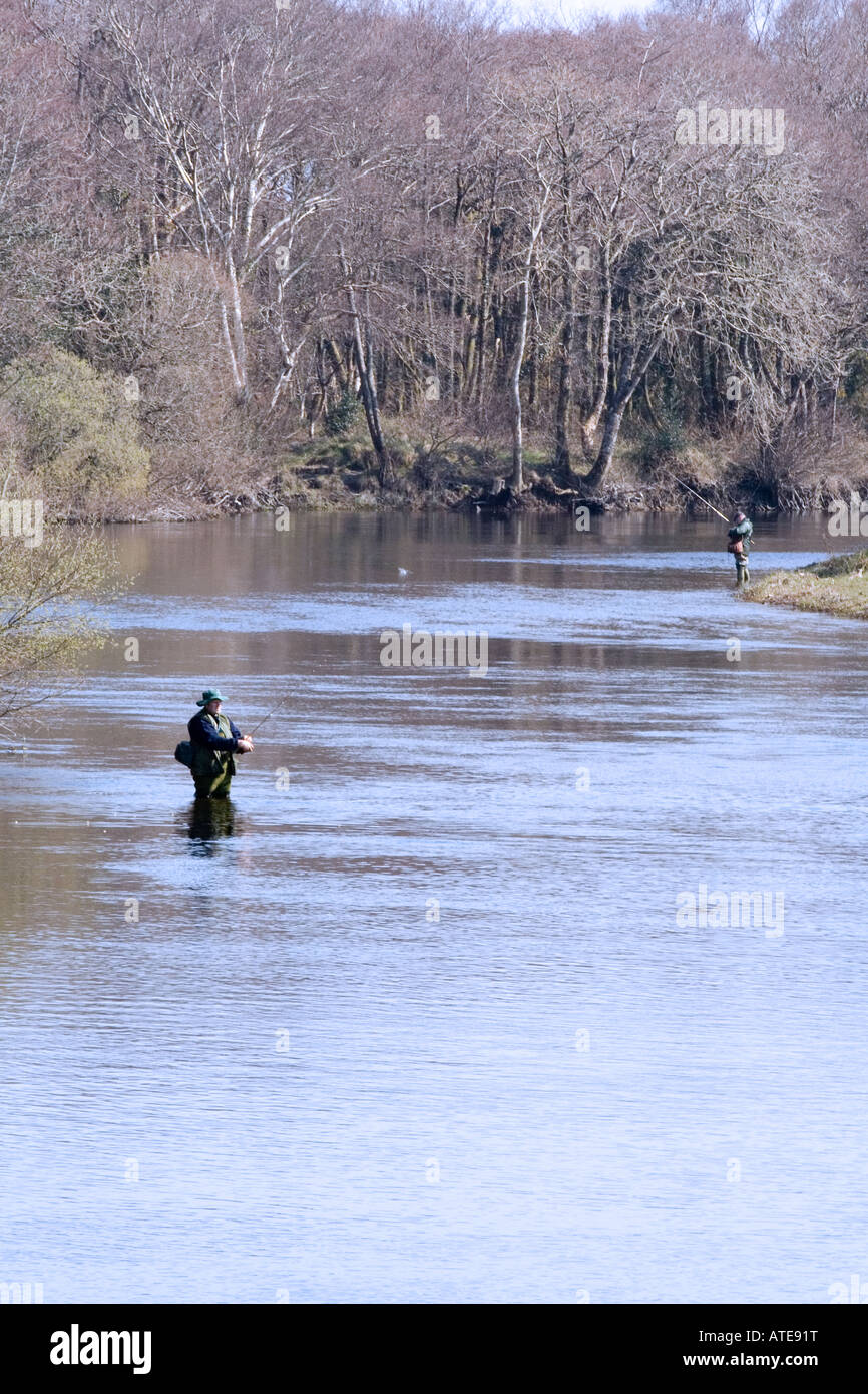 Anglers fly fishing for trout and salmon in a river in Co Kerry Ireland