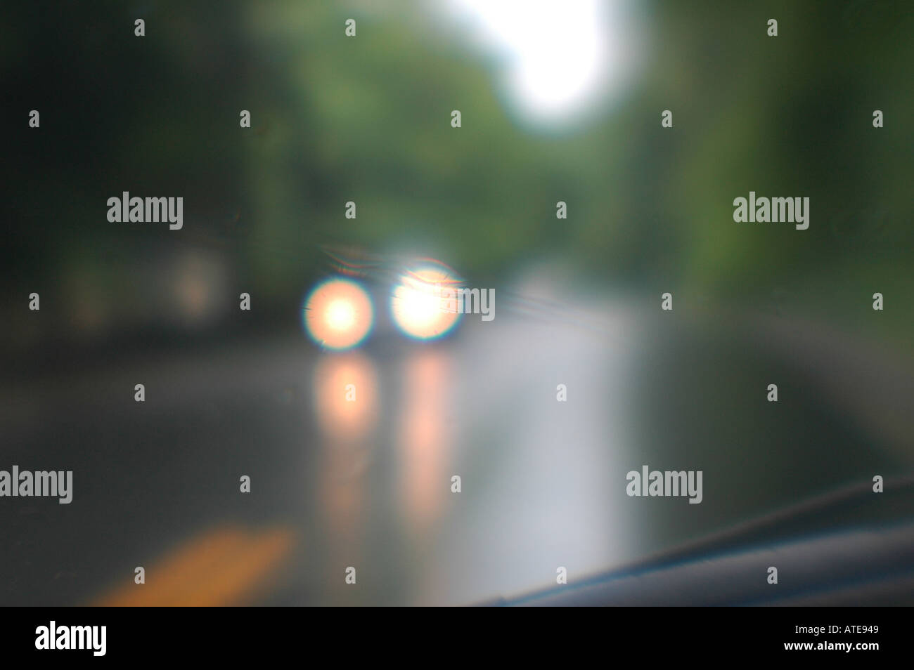 Car blurry headlights rainy day driving Stock Photo