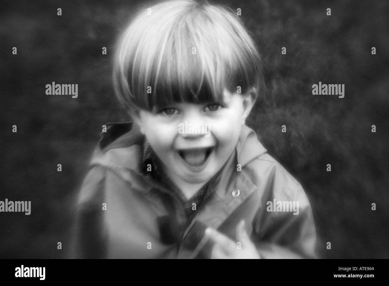 Cute kid smiling face looking at camera Stock Photo