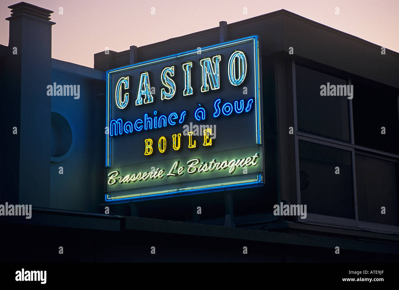 Detail of the brightly lit neon sign of a Casino in Etretat Stock Photo