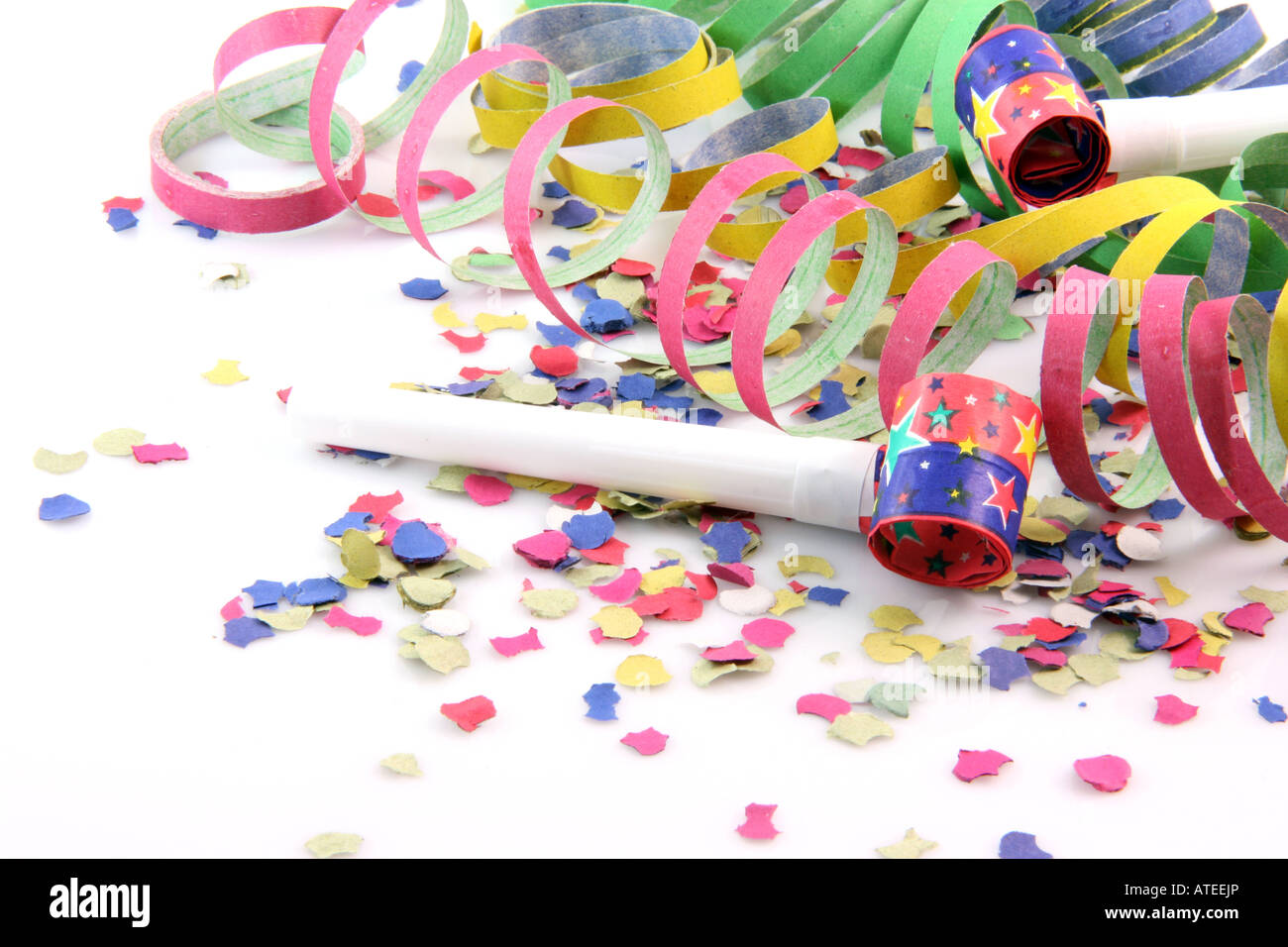 paper confetti with streamers and party blowers on white background ...