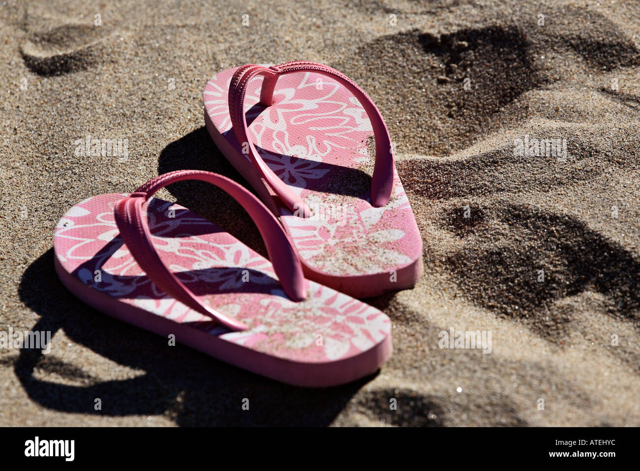 Flip-flops on the beach Stock Photo - Alamy