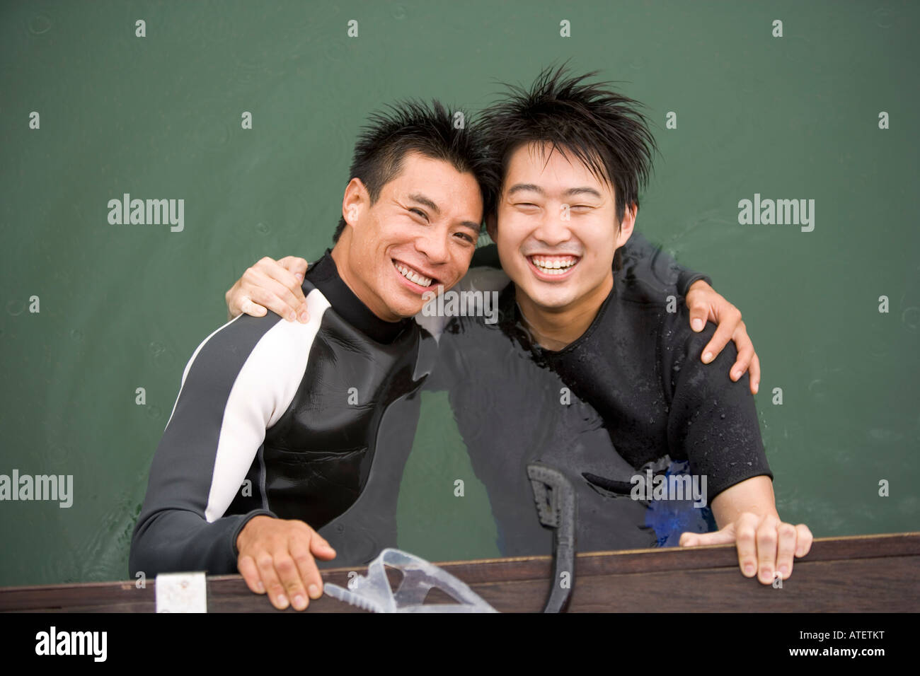 Portrait of two young men smiling Stock Photo - Alamy