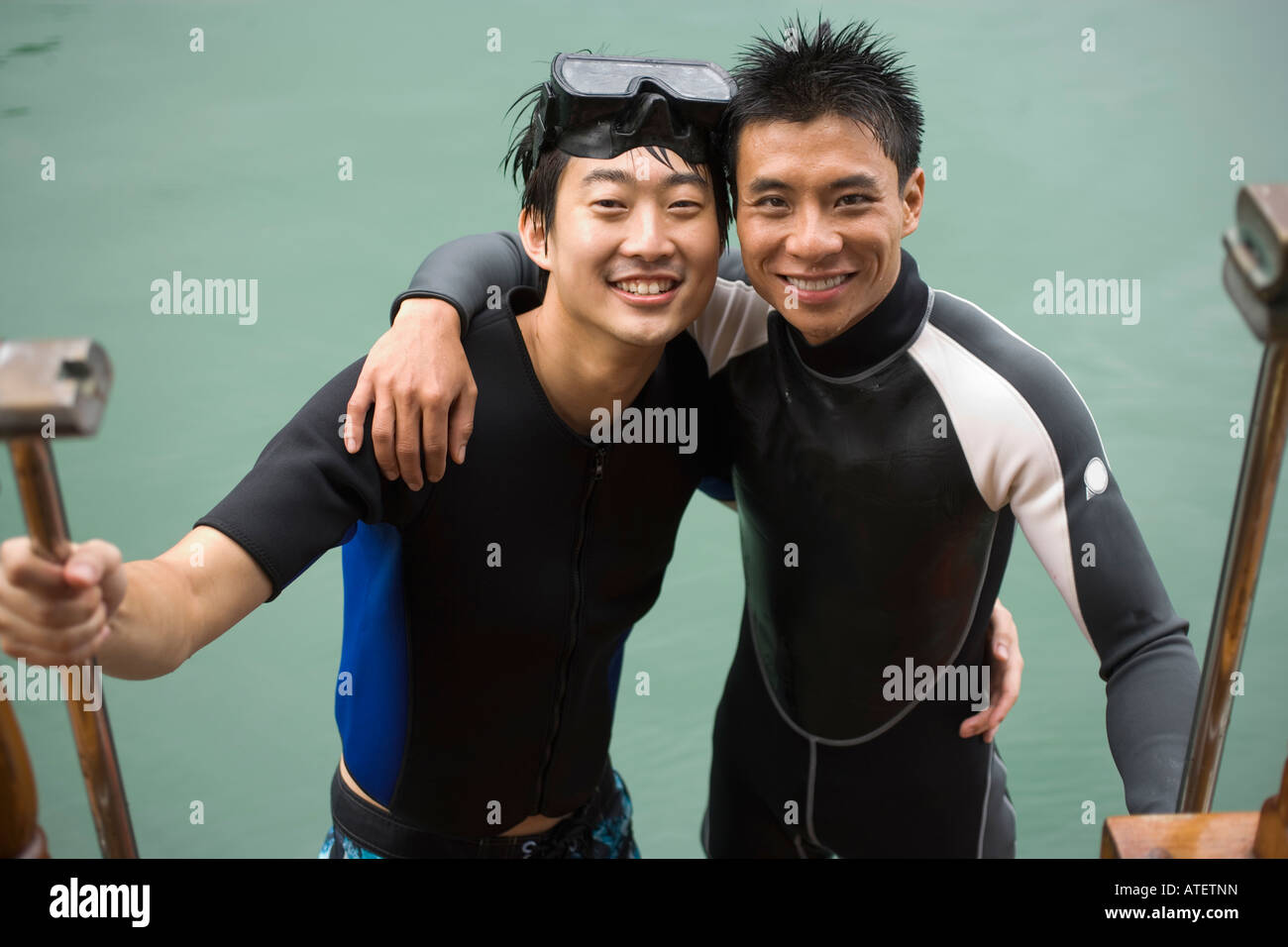 Portrait of two young men smiling Stock Photo - Alamy