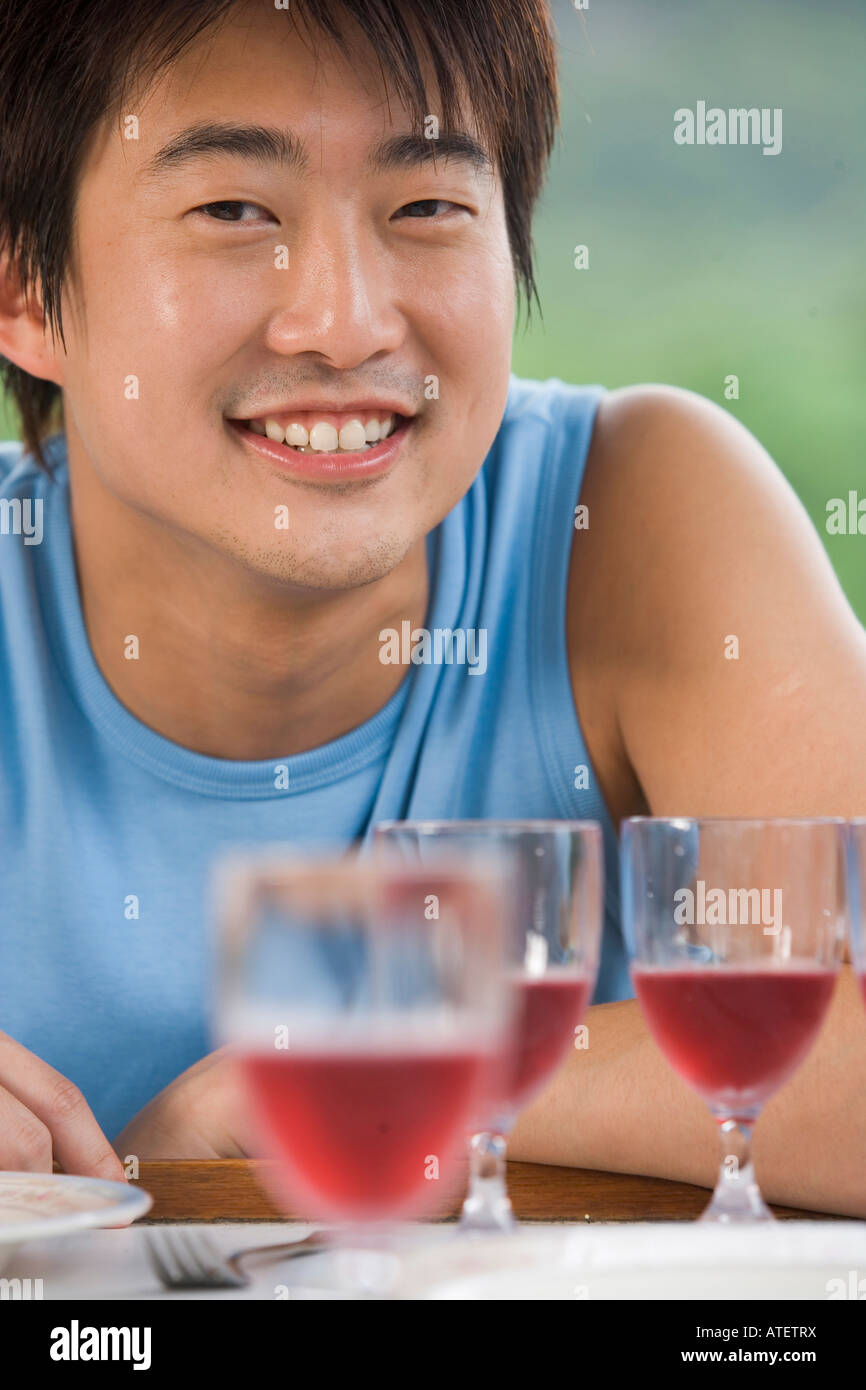 Portrait of young man with wine Stock Photo - Alamy