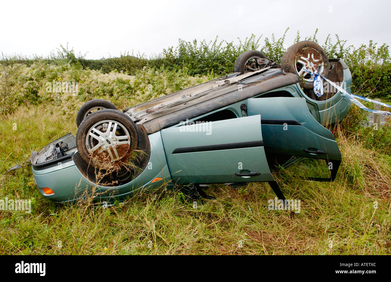 Ford Focus saloon car upside down in field on A449 road Herefordshire England UK GB EU Stock Photo