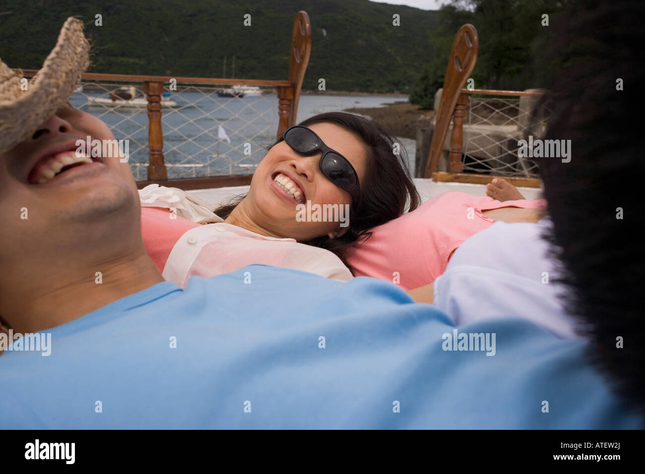 Close-up of a young man and a young woman smiling Stock Photo - Alamy