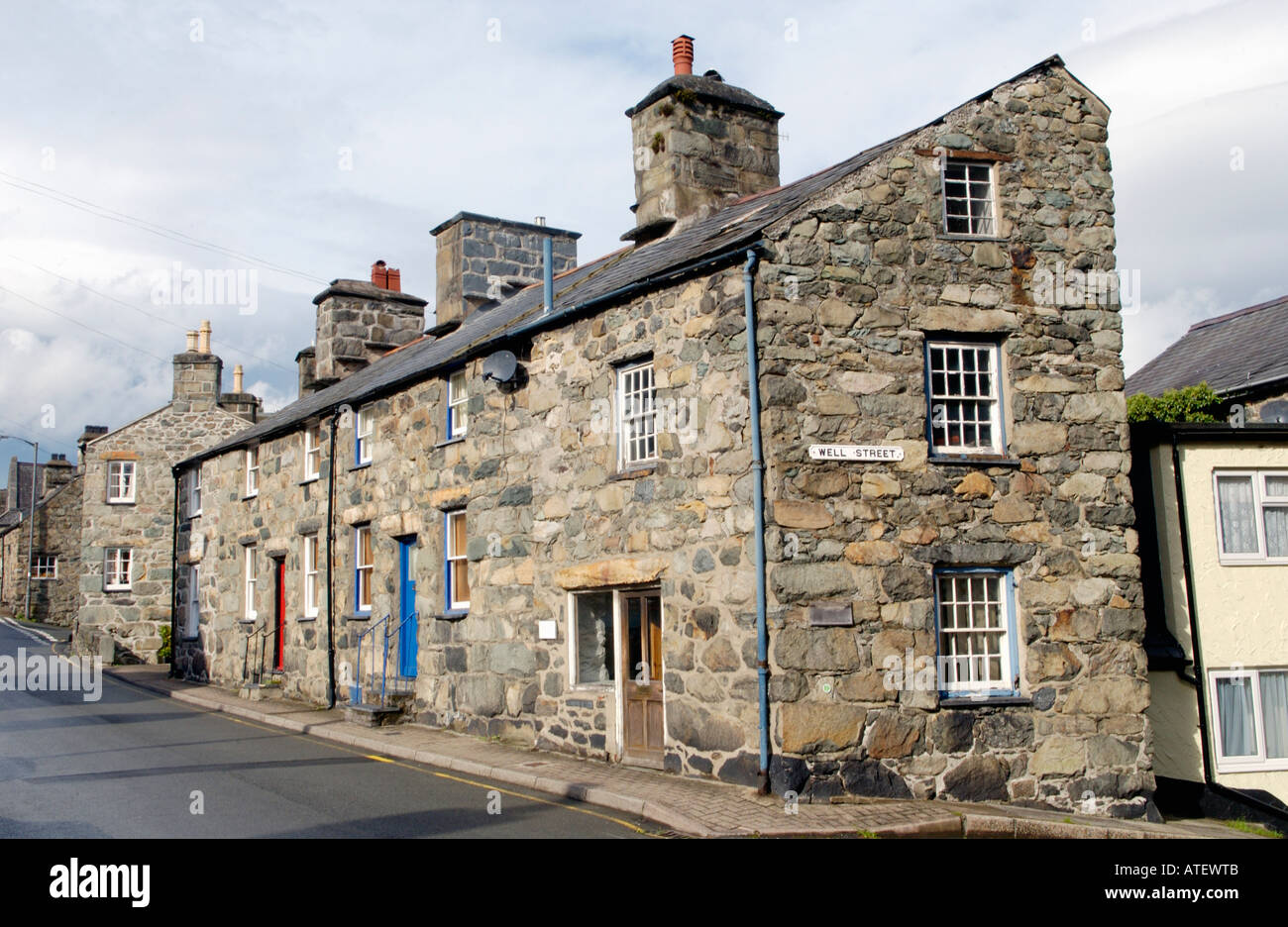 Terrace of traditional stone built terraced cottages typical of the region in Dolgellau Gwynedd North Wales UK Stock Photo