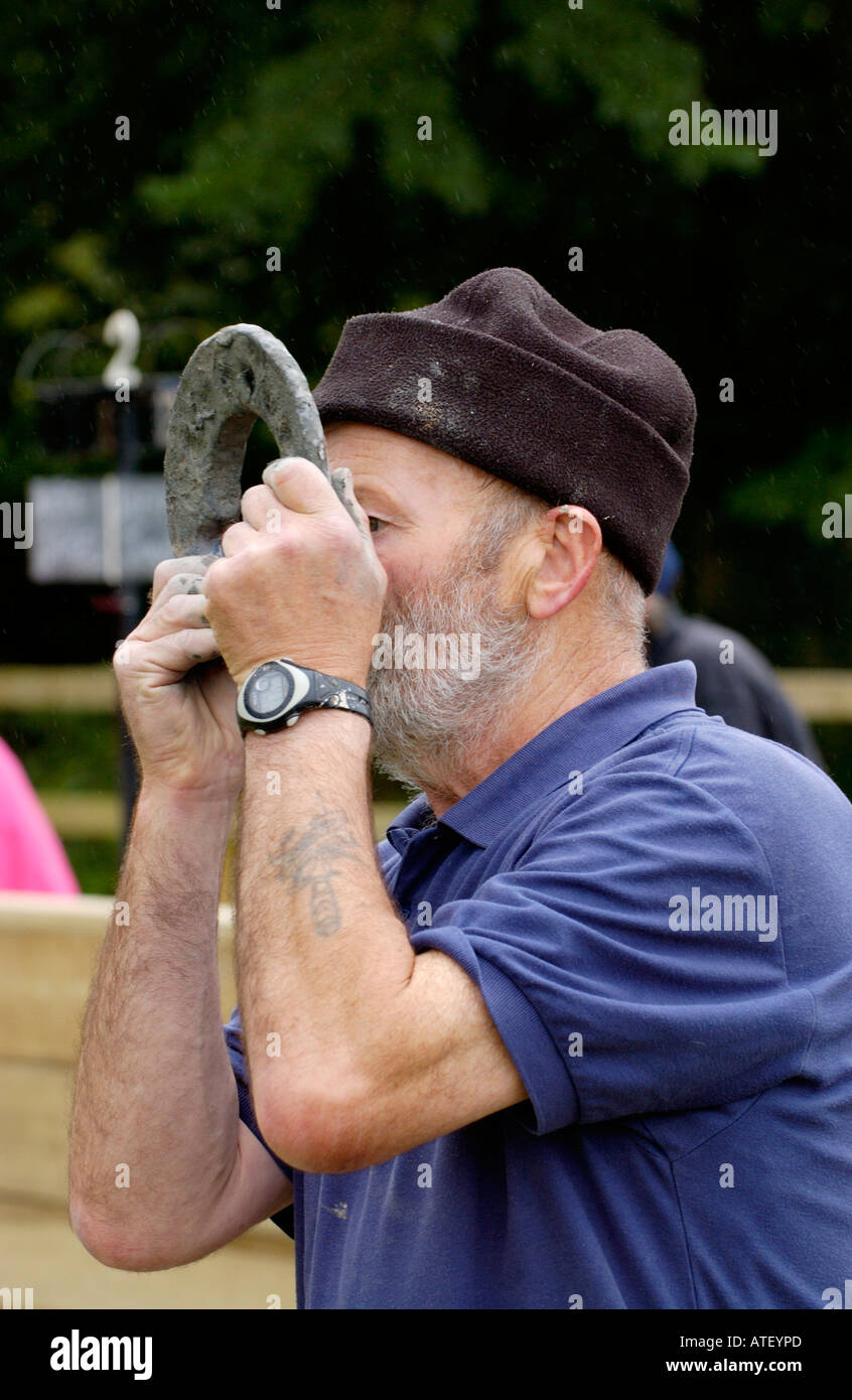 Competitor in the inaugural British Open Quoits Championship in village of Pumpsaint Carmarthenshire West Wales UK Stock Photo