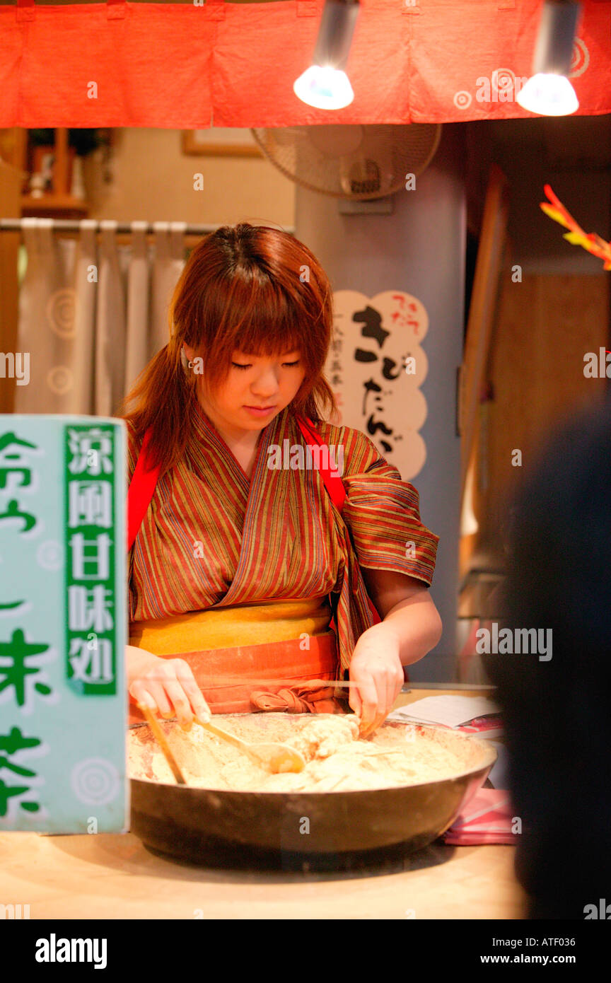 Young girl selling KIBIDANGO millet dumplings Asakusa Tokyo Japan Stock Photo