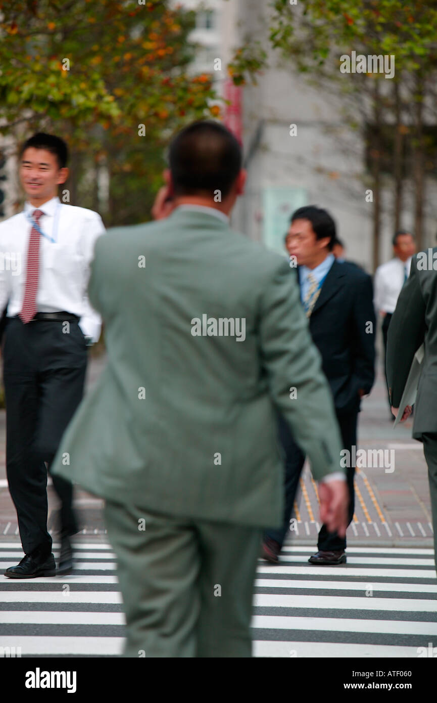 Businessman on cell phone Marunouchi Ginza Tokyo Japan Stock Photo