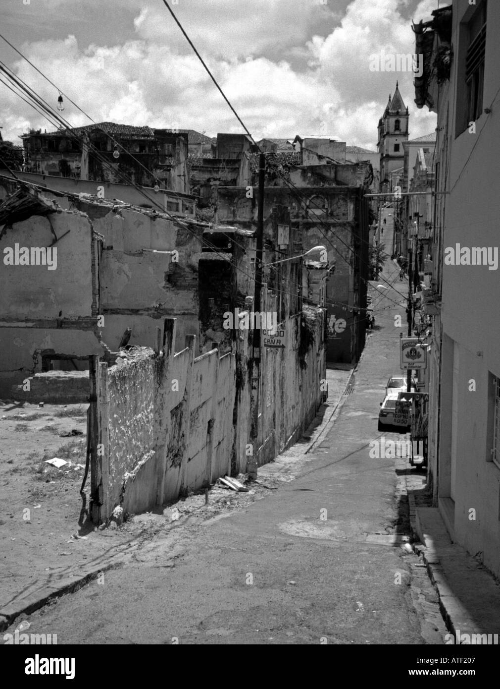 Typical streetscape long descending street down rural town decadent poor hill Salvador Bahia Brazil Brasil South Latin America Stock Photo