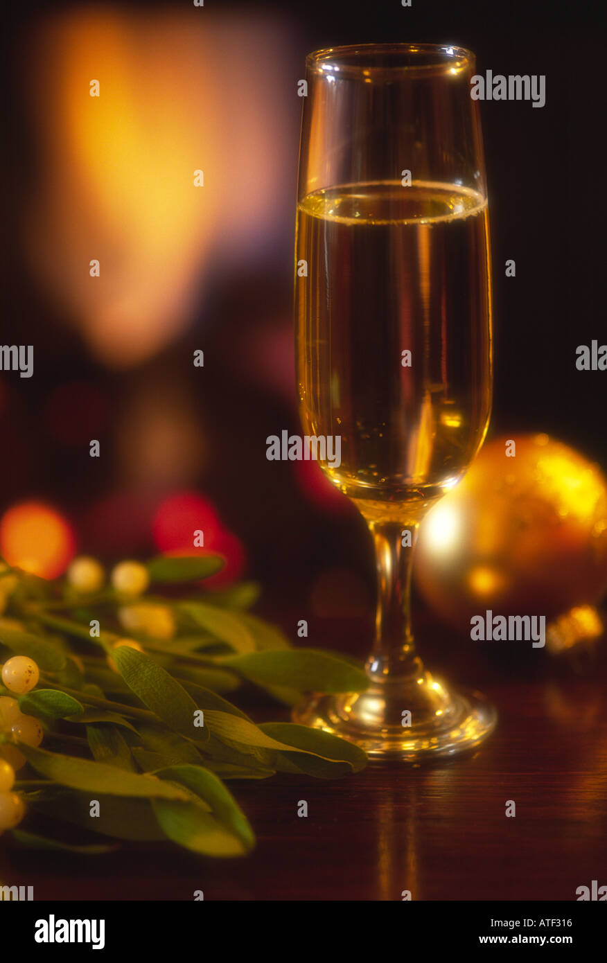Wine Glass in front of fireside Xmas time Stock Photo