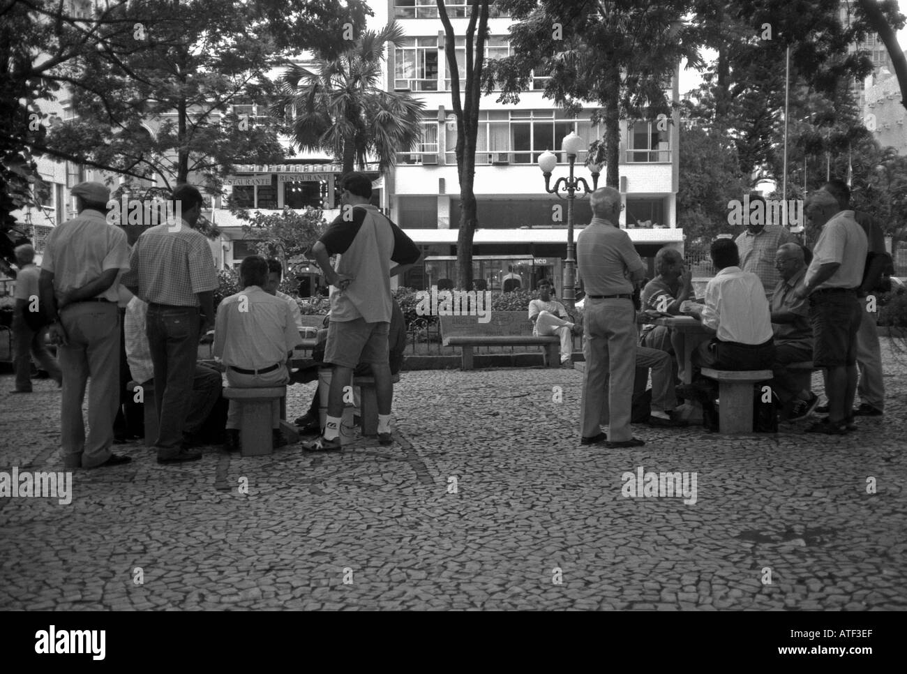 Groups senile men playing cards in public park in city centre Porto Alegre Rio Grande do Sul Brazil Brasil South Latin America Stock Photo