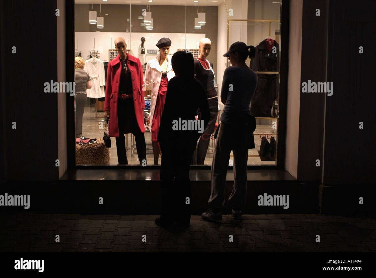 Young Women Window Shopping after Dark Stock Photo