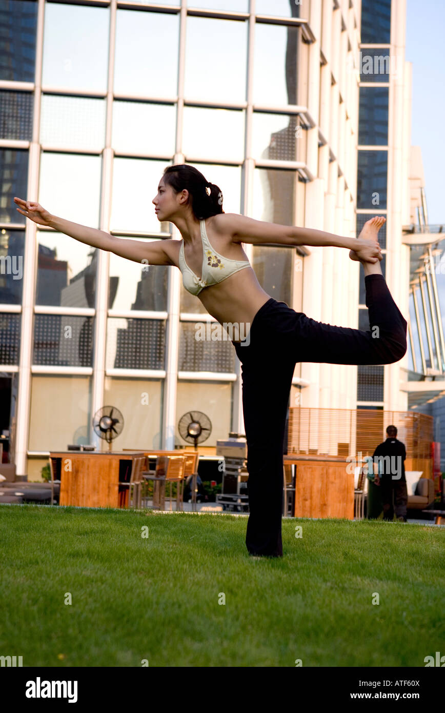 Young woman exercising in the park Stock Photo - Alamy