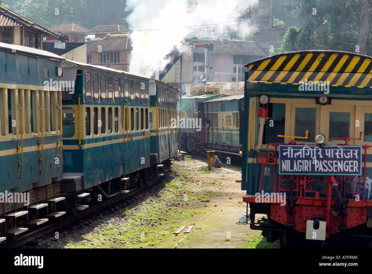 steam train and carriages at coonoor station for the ooty toy train