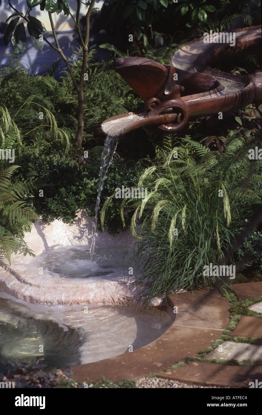 wooden water feature planted with ferns in the 100 pure new zealand