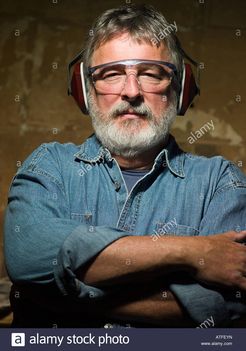 Man Wearing Ear Defenders Stock Photos & Man Wearing Ear Defenders
