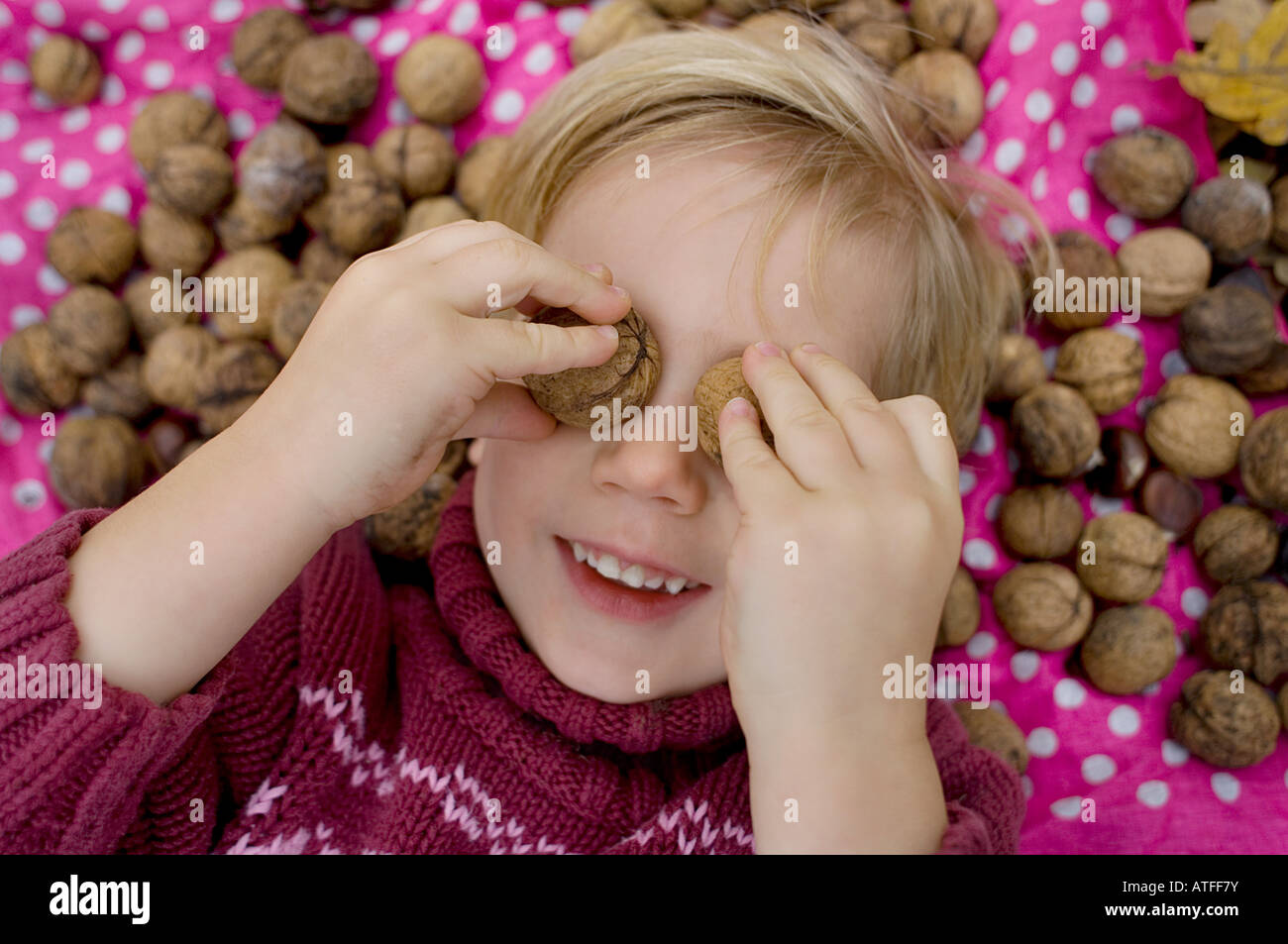 Girl covering eyes walnuts hires stock photography and images Alamy