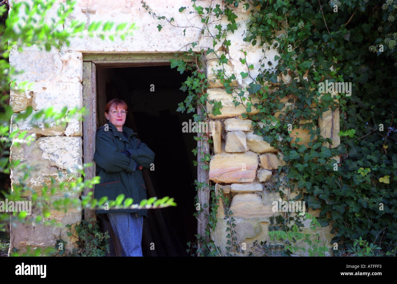 Old building with person woman in doorway 3244 Stock Photo