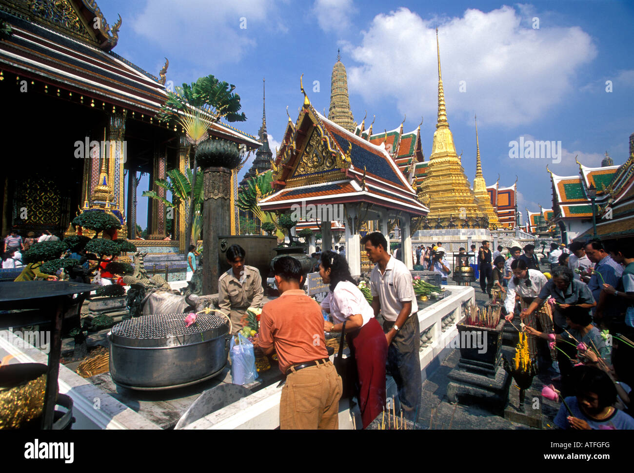 Thai people, making offering, prayer, praying, Wat Phra Si Ratana Sasadaram, Wat Phra Kaeo, Bangkok, Bangkok Province, Thailand, Southeast Asia, Asia Stock Photo
