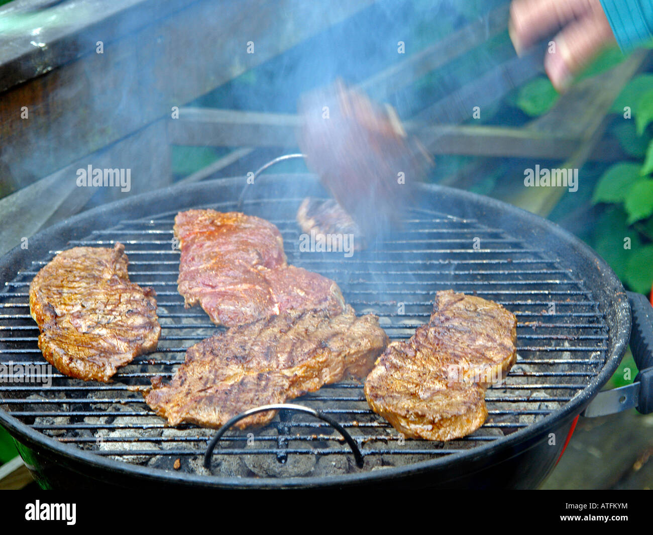 Grilling steaks Stock Photo