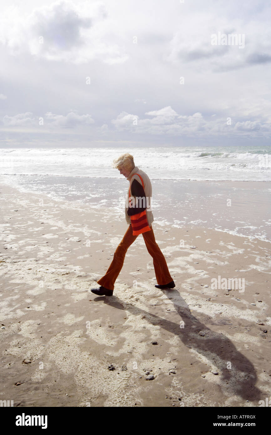 Woman taking a walk on a beach Stock Photo