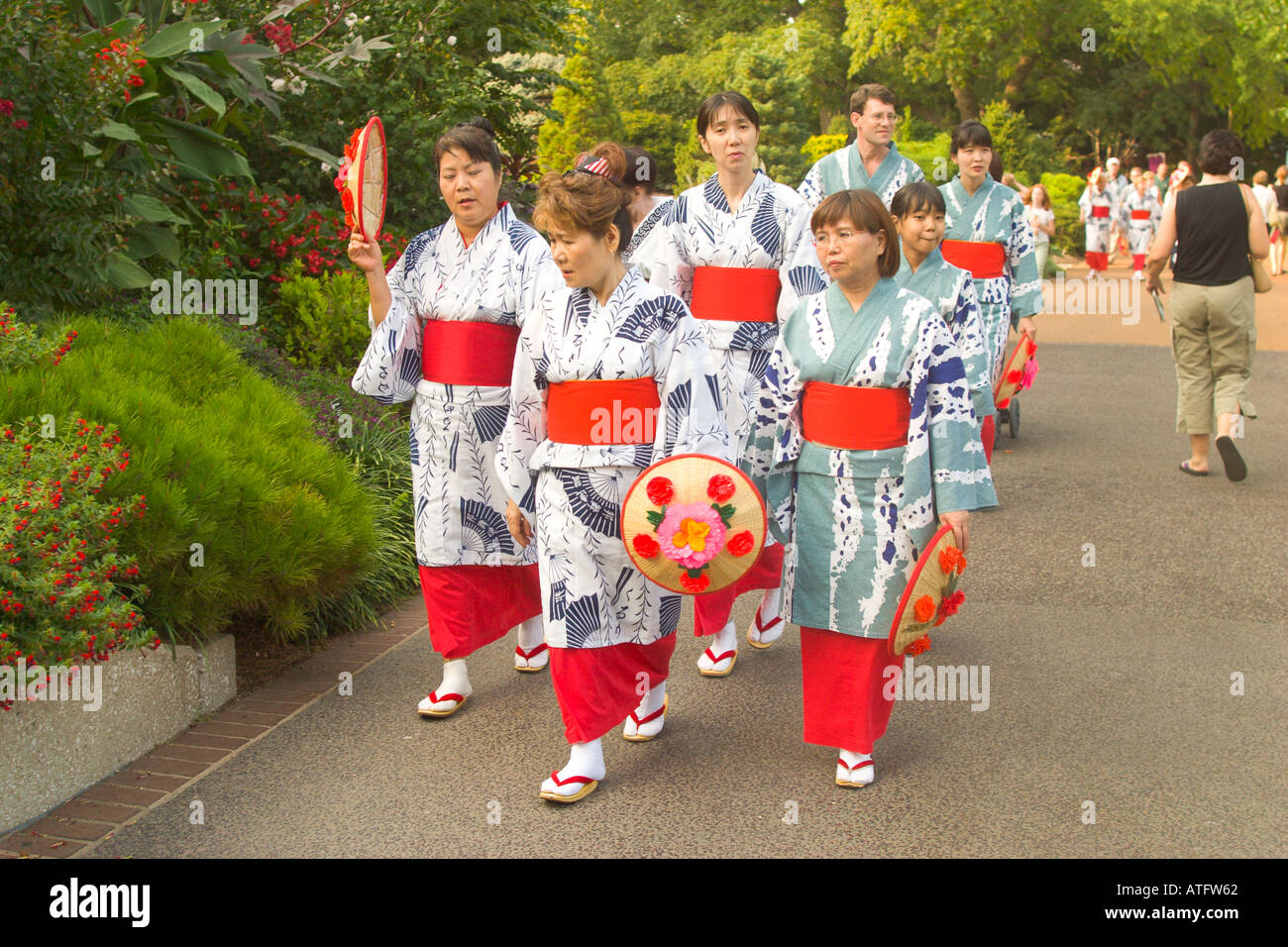 Women in traditional Japanese dress kimono walk together at the Missouri Botanical Garden s Japanese Festival Stock Photo