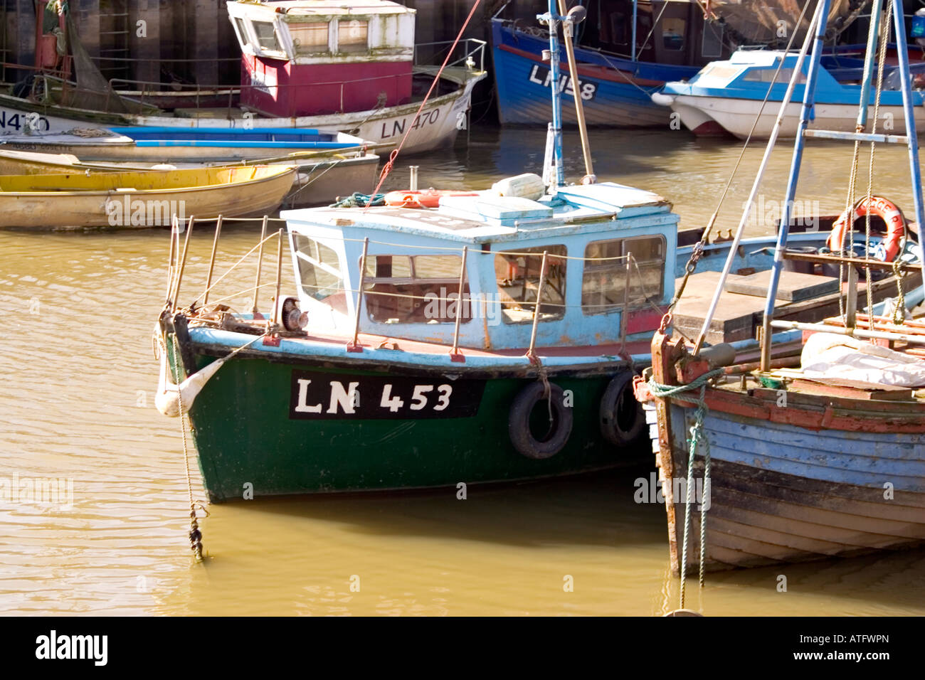 Fishing boat tied to pier hi-res stock photography and images - Alamy