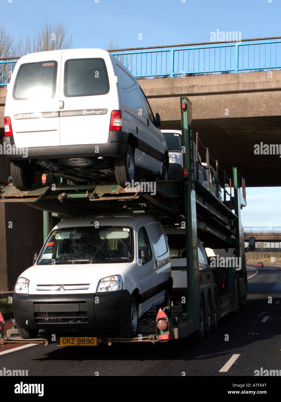 vans on the of car vehicle transporter being delivered along the motorway outside belfast Stock Photo - Alamy