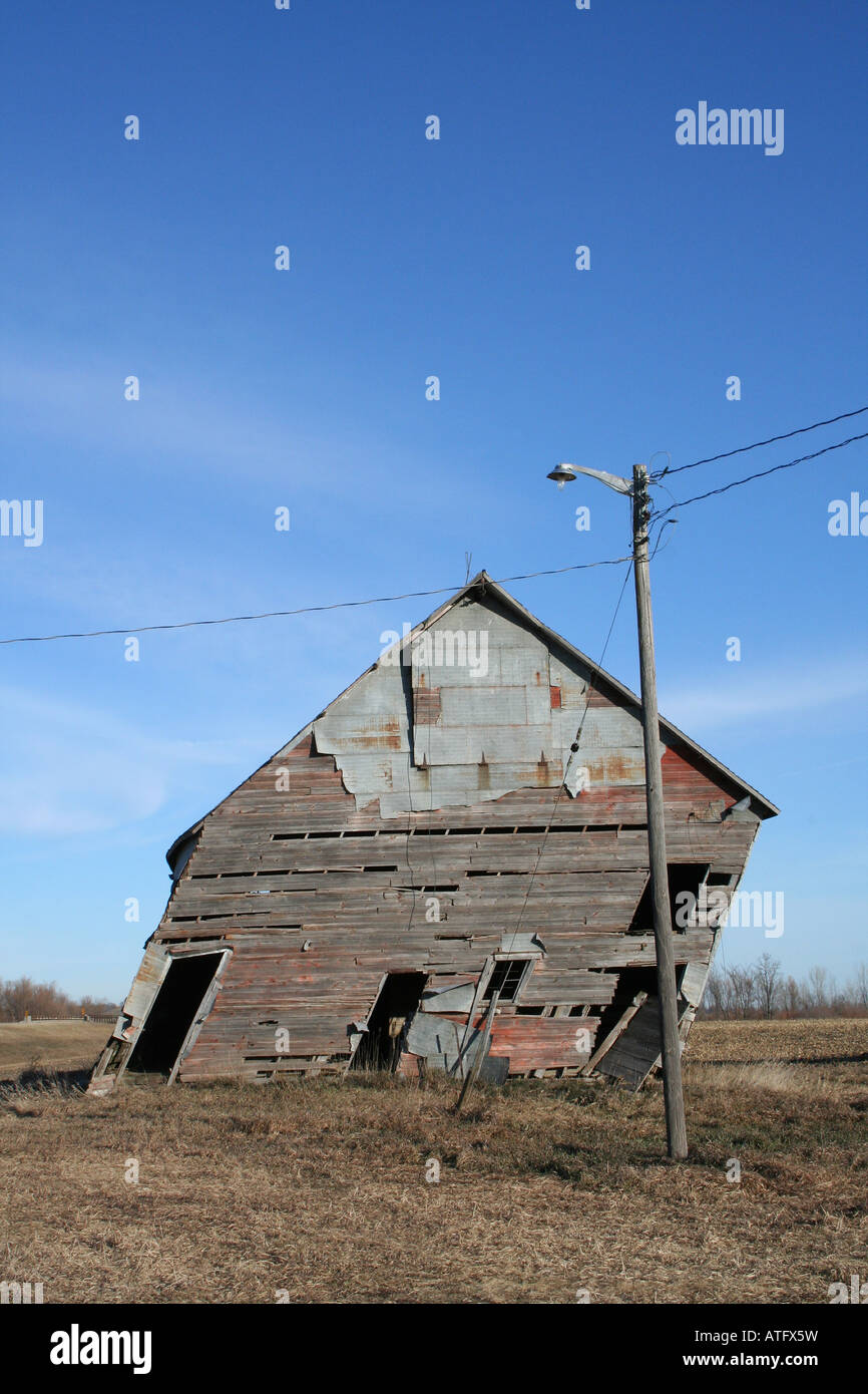 Old barn leaning ready to fall over Stock Photo Alamy