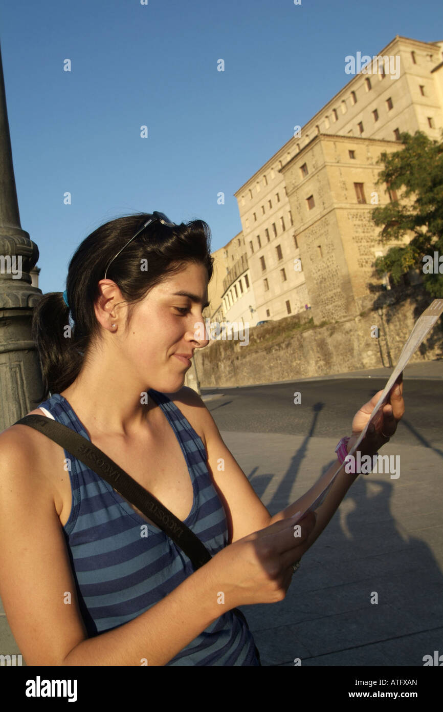 Woman Reading A Guide Female tourist reading guide book hi-res stock photography and images ...