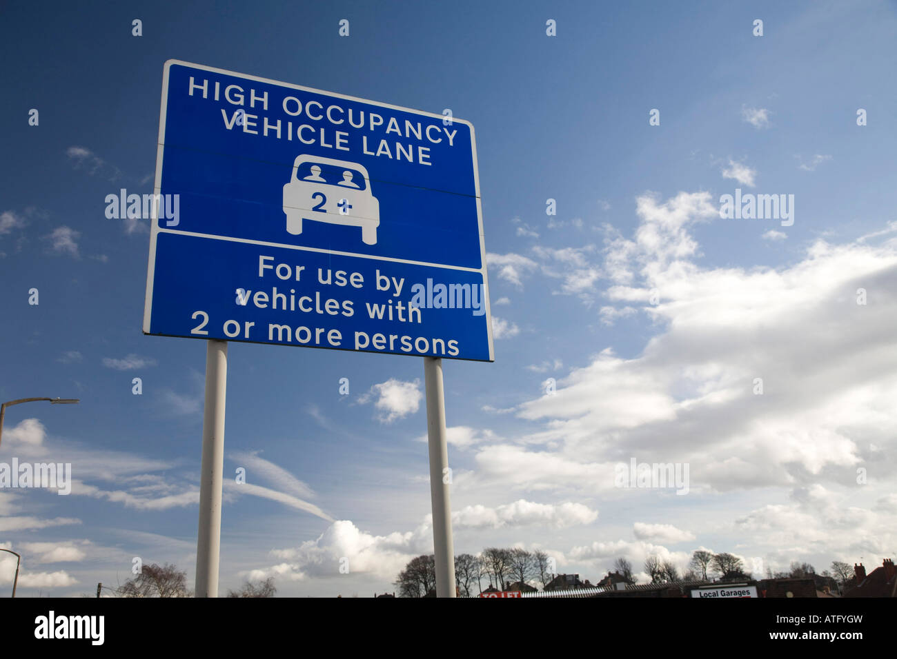 Sign for 2+ Car Sharing Lane in Leeds on the A647. Yorkshire, UK Stock Photo