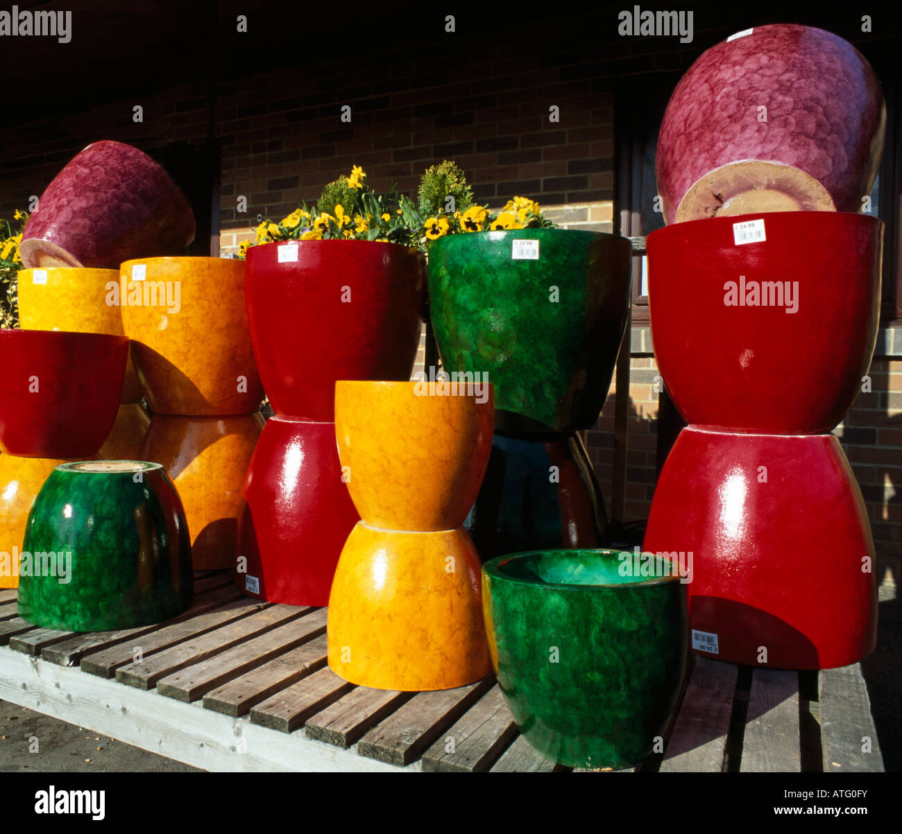 Colourful planter pots for sale Stock Photo Alamy