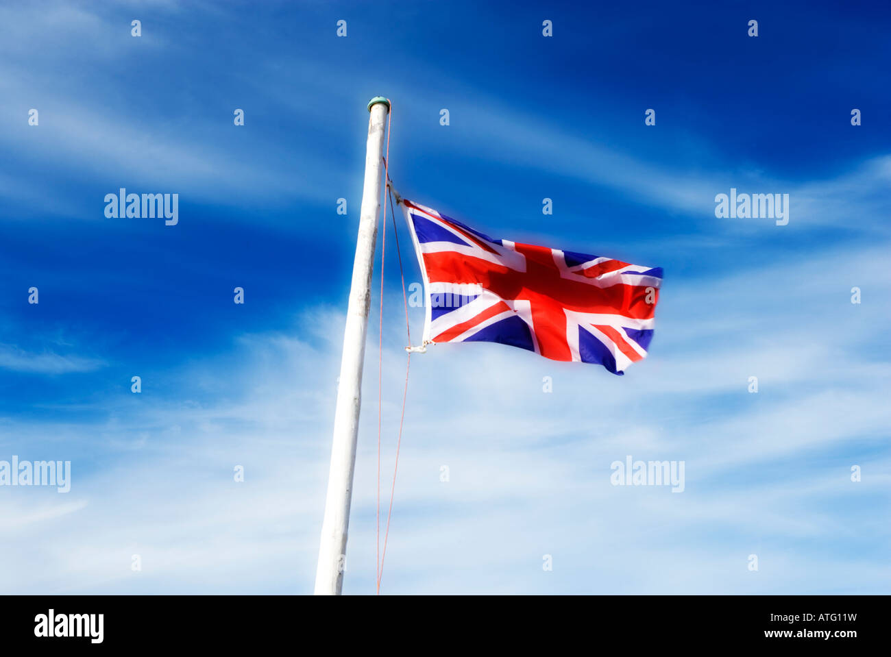Union Jack flying from a flag pole Stock Photo