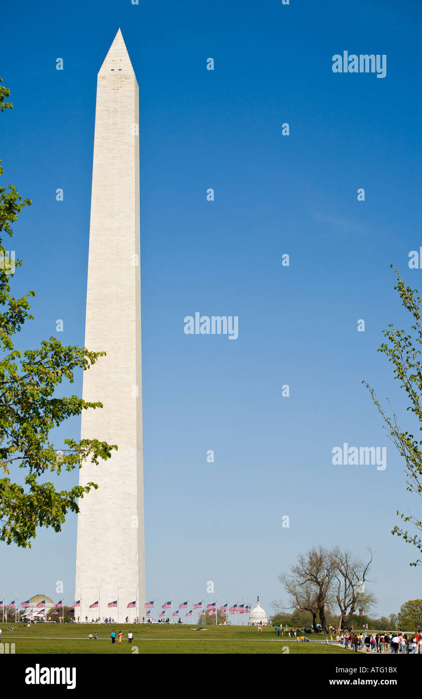 Half Mast at Washington Monument. Tourists mingle with flags at half