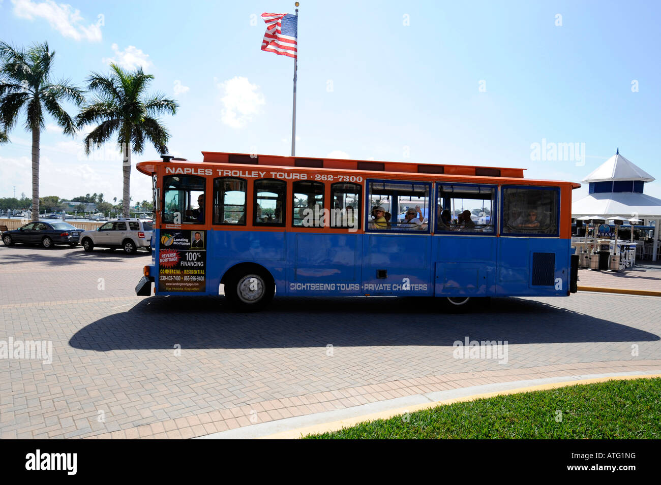 Naples Florida Bayfront Shopping and Residential District trolley tour  Stock Photo - Alamy