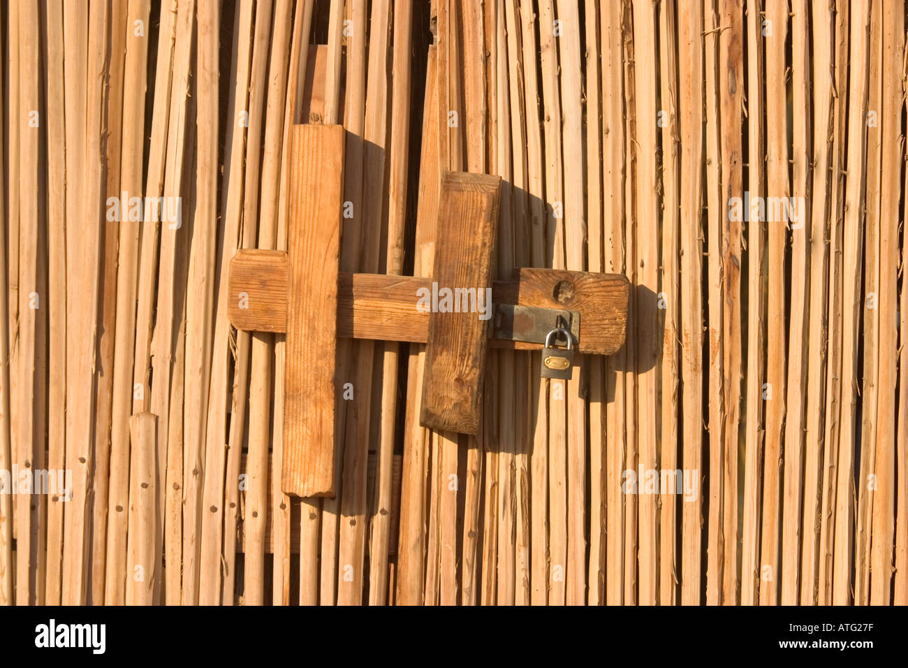 Wooden Lock on Reed Door Stock Photo