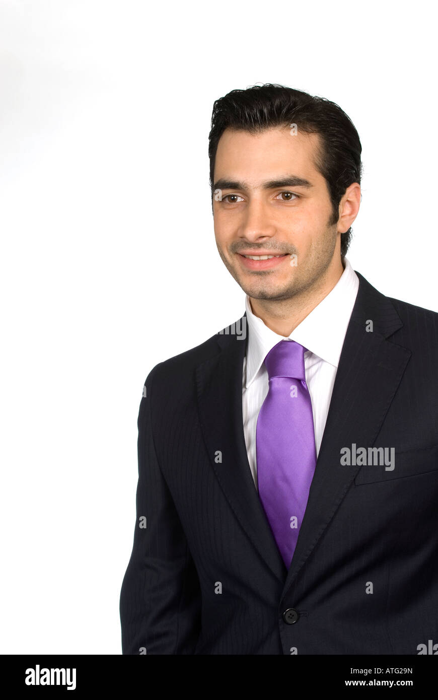Happy business man wearing a suit looking away smiling Stock Photo
